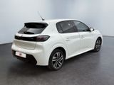 the rear end of a white car in a white room