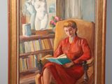 painting of a woman in a red dress sitting in a chair reading a book