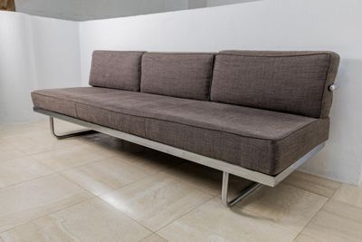 a couch that is sitting in a corner of a room