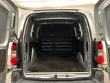 the back end of a van with its doors open and the back door open