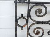 an old iron gate with a rusted design on it