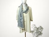 a mannequin with a scarf and a hat on it