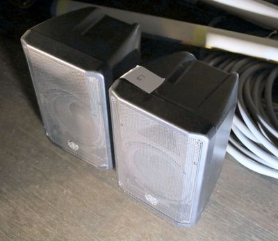 two speakers that are sitting on a table