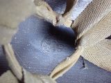 a close up view of a pair of shoes with a knot