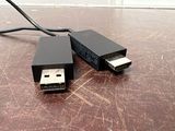 a usb cable that is connected to a small device