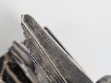 a close up of a knife on a cloth