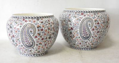 two vases sitting next to each other on a table