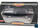 an image of a black toy car in a box on a white background