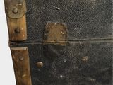 a black suitcase with a wooden handle on a white background