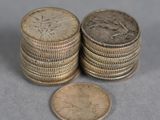 several stacks of coins sitting on top of each other on a table
