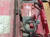 a red tool box with tools in it on the floor