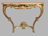 a small table with a marble top on a gray background