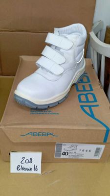 a box with a pair of white shoes on it