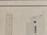 a black and white photo of a door and a window