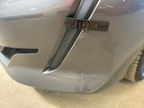 a close up of a car ' s bumper with a sticker on it