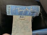 a label on a jacket with a name on it