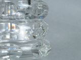 a clear glass vase with a clear base on a table