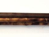 a picture of a wooden object on a white surface