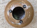 an overhead view of a wooden vase with a hole in it
