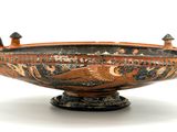 a large bowl with a bird decoration on it