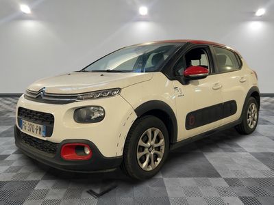 a white citrole is parked on a checkered floor