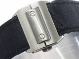 a close up of a watch on a black strap