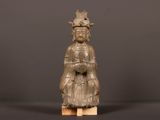 an old wooden statue of a woman with a crown on her head