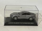 a silver model of a car in a display case