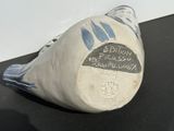 a white vase with a blue and white design on it