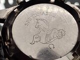 a close up of a watch on a table