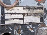 a close up of a rusted machine with a label on it