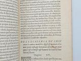 an open book with a black and white image of a bird on it