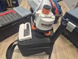 a black suitcase with a vacuum on top of it