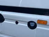 a white van with a hole in the side of it