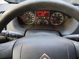 dashboard of a car with a steering wheel and gauges on it
