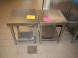 two stainless steel tables with a yellow sticker on them