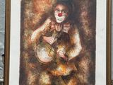 tableau représentant un clown au nez rouge jouant du tambour