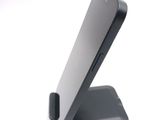 a cell phone that is sitting on top of a stand
