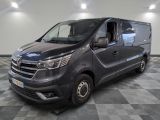 the grey van is parked on a checkered floor in a room