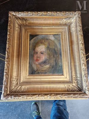 une photo d'un tableau représentant un enfant, dans un cadre doré