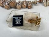 a necklace that has a black and white letter y on it