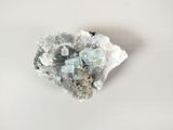a close up of a piece of rock with a lot of crystals on it