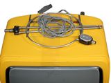 a yellow television set with wires on top of it