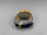 a close up of a watch on a white surface with a blue strap