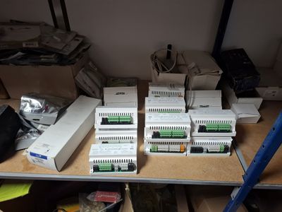 many boxes of electronic equipment sitting on a shelf