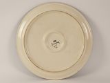 a white plate with a black and white design on it
