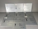 six books on a table with a white background and a black and white photo