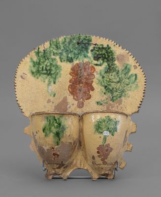 two vases that have been decorated with flowers on them