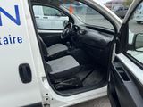 a white van with the door open next to a car
