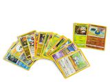 a bunch of pokemon cards sitting on top of each other
